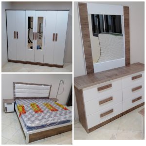 Set Includes: 1. Spacious 6-Door Wardrobe ✔ Built-in mirrors in the center for a sleek and functional design. ✔ Elegant wood & white color combination for a modern touch. ✔ Durable handles with a wooden finish for a premium feel. ✔ Ample storage space for clothes and essentials. 2. Stylish Double Bed ✔ Soft padded headboard for extra comfort. ✔ High-quality wooden frame with a sophisticated white finish. ✔ Comes with a brand-new mattress (plastic-wrapped for protection). ✔ Matching bedside table included for added convenience. 3. Premium Dressing Table with Mirror ✔ 6 spacious drawers for organized storage. ✔ Large mirror with a wooden-textured frame to match the set. ✔ Modern and elegant design that complements any bedroom décor. Price: Only 1,500 SAR 🚚 Fast & Secure Delivery Across Saudi Arabia